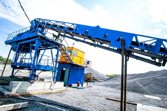 Cement production factory in quarry. Construction crane