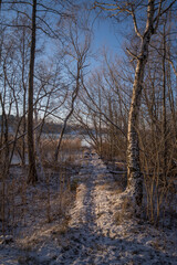 Old stone jetty at the lake Mälaren, a pale winter day in Stockholm