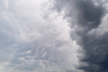 Dramatic sky with mammatus. Mastodontic cloud with altocumulus