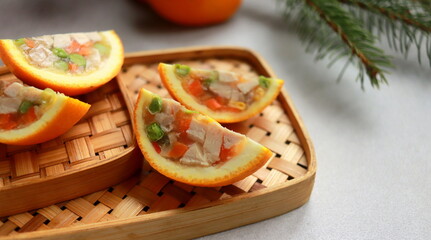 appetizer of jellied chicken with vegetables in orange close up selective focus