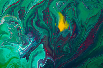 Beautiful liquid texture of the nail polish.Green and purple colors.Multicolored background with copy space.Fluid art,pour painting technique.Good as digital decor.