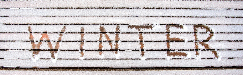 The word WINTER in the snow