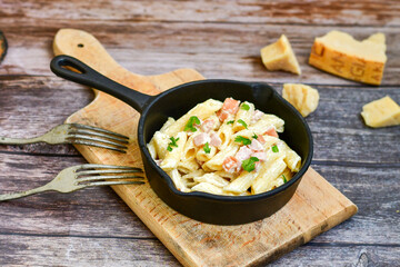  Fresh home made italian  penne  pasta   alla carbonara with  cream sauce  ,  bacon,egg, parmesan cheese ,olive oil and black pepper) 