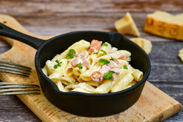  Fresh home made italian  penne  pasta   alla carbonara with  cream sauce  ,  bacon,egg, parmesan cheese ,olive oil and black pepper) 