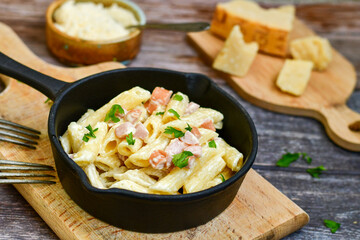  Fresh home made italian  penne  pasta   alla carbonara with  cream sauce  ,  bacon,egg, parmesan cheese ,olive oil and black pepper) 
