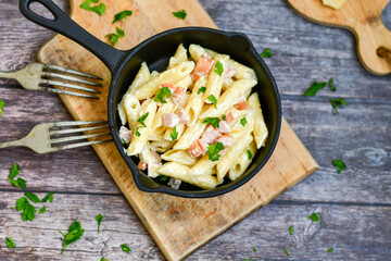  Fresh home made italian  penne  pasta   alla carbonara with  cream sauce  ,  bacon,egg, parmesan cheese ,olive oil and black pepper) 