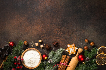 Christmas baking Ingredients with holiday decorations. Top view with copy space.