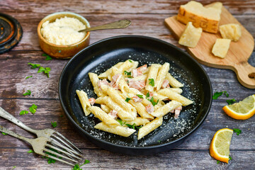  Fresh home made italian  penne  pasta   alla carbonara with  cream sauce  ,  bacon,egg, parmesan cheese ,olive oil and black pepper) 