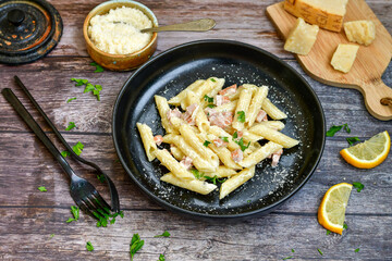  Fresh home made italian  penne  pasta   alla carbonara with  cream sauce  ,  bacon,egg, parmesan cheese ,olive oil and black pepper) 