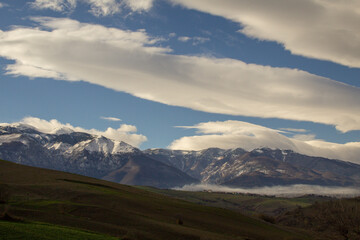 View of the Majella mountain in Abruzzo Italy with snowy peak and sky with clouds
