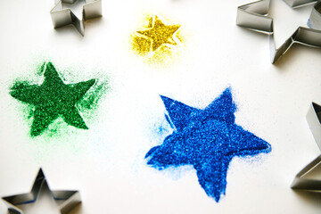 Abstract texture of small sequins in the shape of a star.Multicolored sequins on a white background.