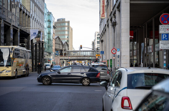 The high traffic in Berlin with cars, s bahn and cyclists in Friedrichstrasse.
