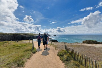 People,walking along the wild coast at the Quiberion peninsula in Brittany France