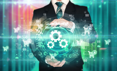 Businessman holding technology icon concept