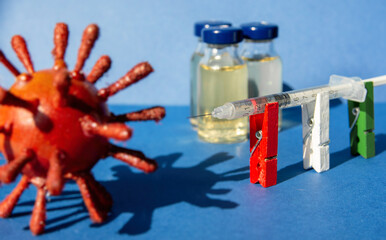 new variant virus body  and syringe with vaccine ampoule, concept of mass vaccination of the...