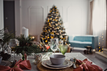 New Year's Christmas table, setting for a festive dinner. Home interior.