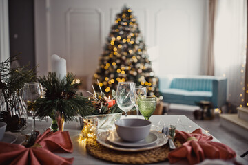 New Year's Christmas table, setting for a festive dinner. Home interior.