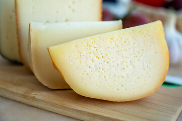 Cheese collection, French fol epi  cheese with many little holes, etorki, tomme noire des pyrenees and ossau iraty cheese