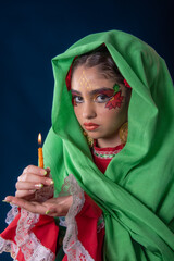 Mexican teenager with red dress and facial makeup rebozo and sparklers celebrating Mexican...