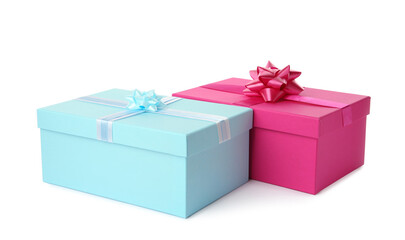 Pink and light blue gift boxes with bows on white background