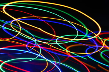 Multicolored lines on a black background patterns graphic on a long exposure