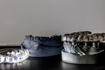 Dental splint against bruxism and grinding teeth with teeth imprint and dental healthcare of an orthodontist as dental protection in a medical dentistry is important to keep the teeth healthy © sunakri