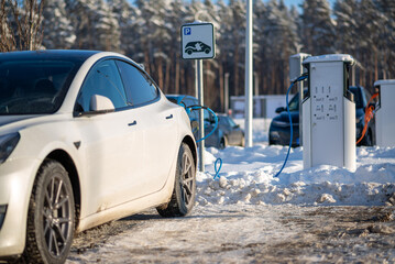 Electric car charging at a station