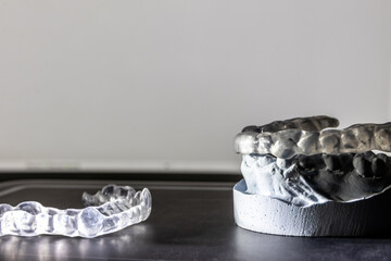 Dental splint against bruxism and grinding teeth with teeth imprint and dental healthcare of an orthodontist as dental protection in a medical dentistry is important to keep the teeth healthy © sunakri