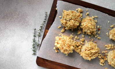 scallops in cheese breading before baking close-up selective focus, seafood.