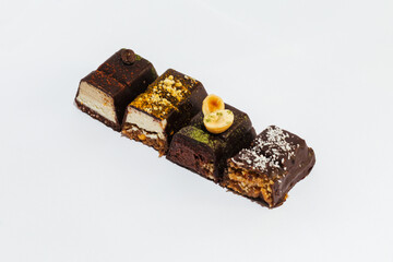 Close-up Vegan, chocolate cutaway candies on white background. Homemade bakery. Delicious and sweet.