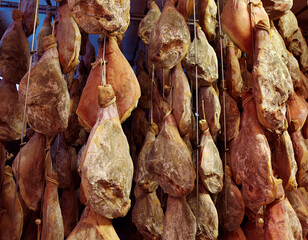 Dried pork hanging on ropes