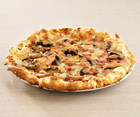 Delicious pizza served on wooden table