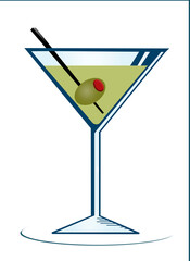 Martini glass with liquor, olive and swizzle stick isolated on a white background.