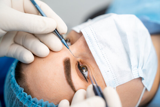 Laser woman eye correction. Operation with laser vision correction. Cropped view. Stock photo