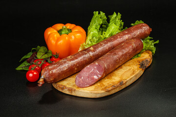 Pork ham sausage cut isolated