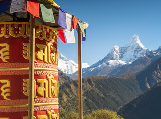 view to summit Ama Dablam through collared praying drum in Nepal