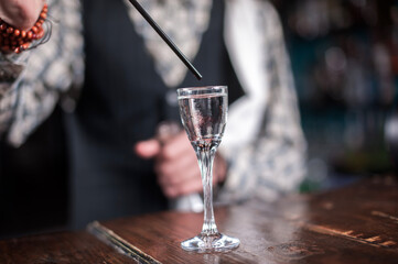 Barman makes a cocktail on the brasserie