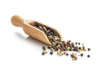 Whole pepper in wooden scoop