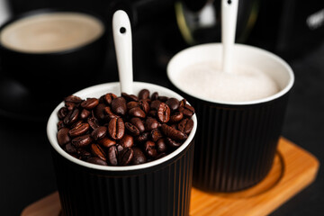 Coffee beans on a dark background. Coffee beans in cup.