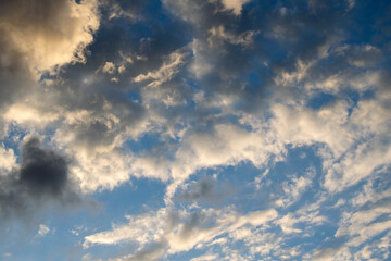 Scattered clouds in the blue sky, sunset in rural area of Guatemala