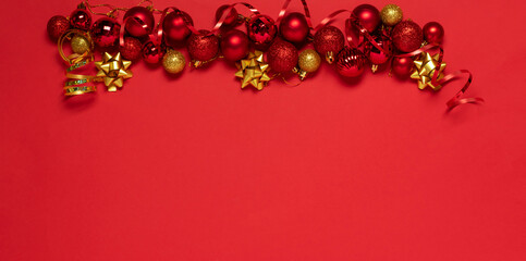 Christmas gold red decorations Christmas balls toys, red background. New Years Christmas concept. Flat holiday mockup