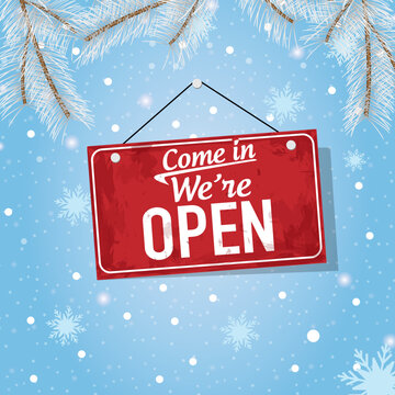 Come in We're Open. Winter concept background. Red sign for the store
