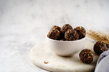 No bake raw energy protein balls with oats nuts and dates, selective focus