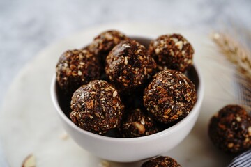 No bake raw energy protein balls with oats nuts and dates, selective focus