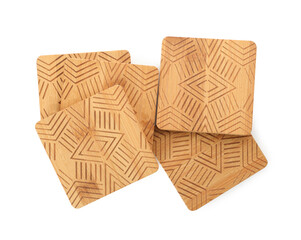 Wooden cup coasters on white background, top view