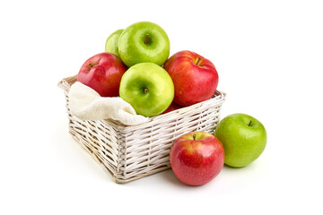 Fresh apples in basket, isolated on white background.