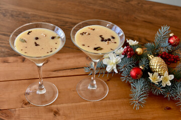 Fancy holiday eggnog and coffee martini drinks ready to serve at home or party, restaurant at Christmas season event. 