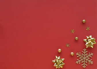 Fototapeta na wymiar Christmas composition. Christmas gold decorations on red background. Flat lay, top view