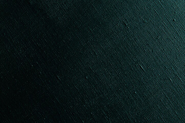 dark creative background: black primed linen canvas, uneven lighting, color toning