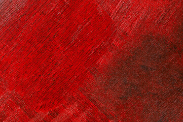 abstract creative background: red stain of colored primer when toning the canvas, temporary object.